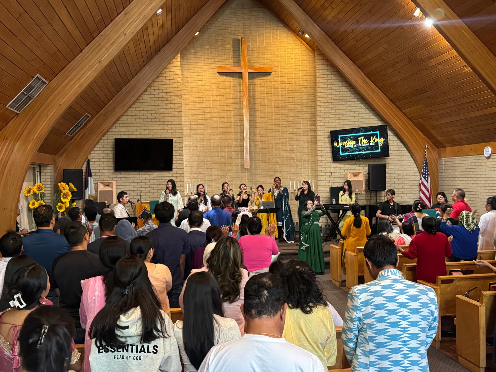 Worship team leading the congregation in song at Restoration International Ministries